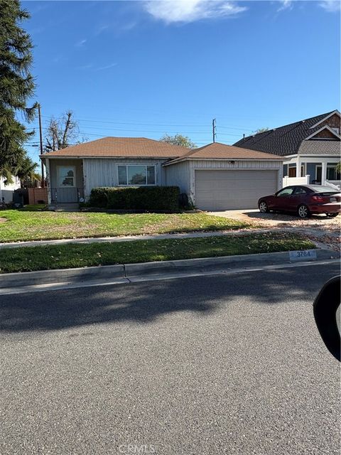 Photo of 3764 Conquista Ave Ave, Long Beach, CA 90808 (MLS # RS26017309)