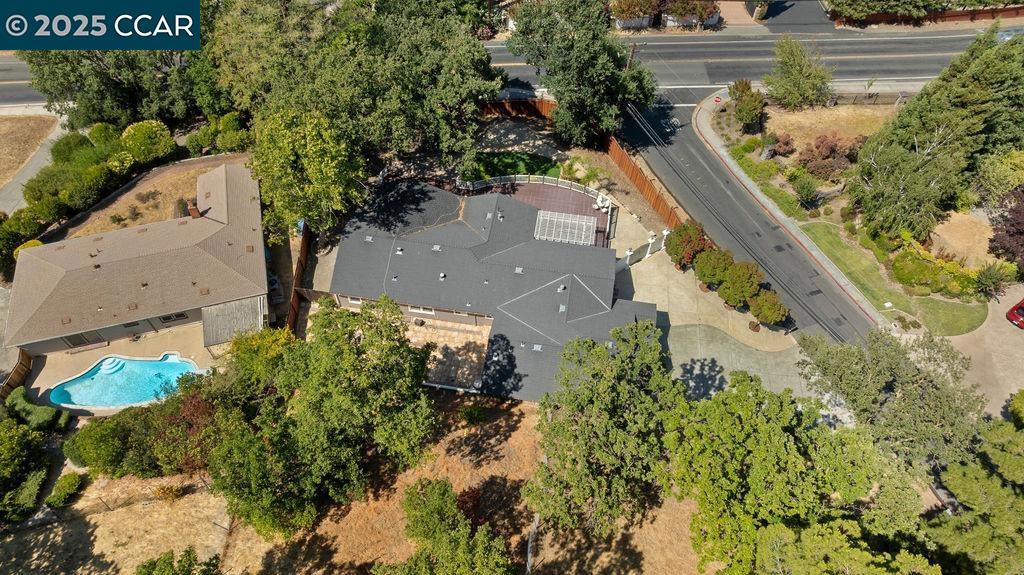 Half an Acre of a corner lot with room to build your own Pickle Ball Court in Acalanes Union High School District? Yes!! Welcome to 11 Rudgear Dr—Former 4-Bedroom Home with a Luxe Walk-In Dream Closet single-story home. The original 4-bedroom layout now includes a stunning dressing room that can double as a home office, nursery, or easily revert to a bedroom. It sits on nearly half an acre in a prime Walnut Creek location. With 2,119 sq ft of light-filled living space, hardwood floors, a cozy fireplace, and a large family room, this home blends comfort and style. The eat-in kitchen offers stone countertops and plenty of storage. Step outside to a huge private yard with a deck—perfect for entertaining, relaxing, or future expansion. Minutes to downtown, top-rated schools, BART, and Heather Farm Park—Walnut Creek’s 102-acre gem with trails, pool, dog park, and more. Views: Ridge
