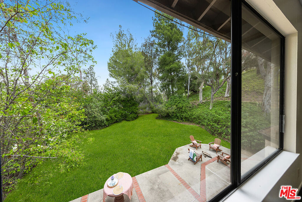 Discover the perfect blend of serenity and convenience in this Anaheim Hills home. Nestled in a peaceful cul-de-sac and framed by professional landscaping and mature trees, this 4-bedroom, 2.5-bathroom residence offers a private retreat. The spacious formal family room, bathed in natural light from large windows, provides a welcoming ambiance and direct access to the backyard. Enjoy seamless transitions from the formal dining room, breakfast area and to the functional kitchen, offering ample storage and picturesque backyard views. A cozy fireplace anchors the open living room, creating an inviting space that extends to the expansive backyard via sliding doors from both the breakfast nook and living area. The sizable backyard is an entertainer's dream, ideal for creating lasting memories. In Spring and early summer the bird and butterfly migrations come through offering a unique opportunity for taking in these natural wonders. Additional features include a full-sized laundry room, wet bar, half-bath, and a 2-car garage with direct access to the home. Upstairs, the large primary bedroom offers a private ensuite with a soaking tub, shower enclosure, tiled floors, dual sinks, and ample counter space. Three secondary bedrooms share a refreshed center hallway bathroom. Enjoy the peaceful ambiance while being just a short drive from local shopping like Mother's Market, dining, hiking, biking trails, horse trails and the Anaheim Golf Course.