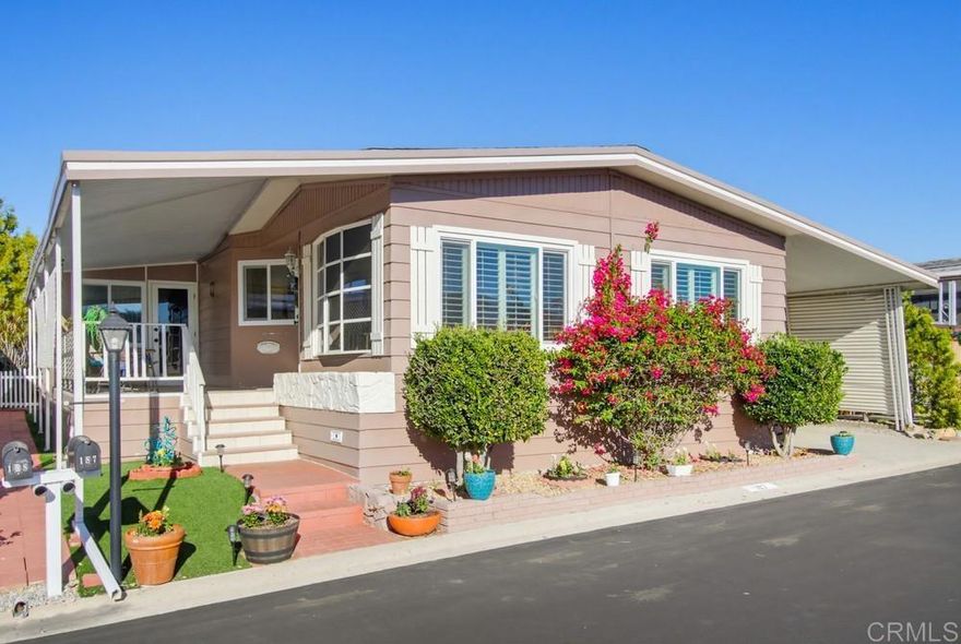 Beautifully updated two bedroom and two bath home in Palomar Estates East.  The charming kitchen has solid surface countertops, a tile backsplash, and single basin stainless steel sink.  The skylight brings abundant natural light to the kitchen.  Both bathrooms have been remodeled with the primary bathroom having a wonderful tiled shower.  The attached large California room gives you more space not included in the homes square footage.  There is a shed in the back yard to store your extra things.  This home is on registration which means NO PROPERTY TAX.  Palomar Estates East is a 5 star 55+/35+ senior rent controlled park with many activities and amenities including a beautiful clubhouse, pool, spa, gym, putting green, pickleball courts, and tennis courts. This home is located minutes to Lake San Marcos dining and golf as well as local Carlsbad beaches, shopping, and restaurants.