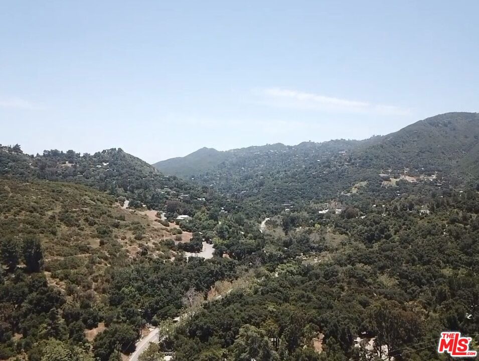 APN: 4438-013-007. Approx 40,070 SF lot. Zoning LCR11L. Nestled in the serene and sought-after area of Topanga, this expansive vacant lot offers just over one acre of prime land, zoned LCR11L, perfect for building your dream home. Tucked away at the end of a quiet cul-de-sac, this secluded property provides an ideal setting for those seeking privacy and tranquility. Enjoy breathtaking mountain views and the natural beauty of the surrounding area, all while being centrally located near the vibrant communities of Topanga, Calabasas Hills, Malibu and Mulholland Hwy. Accessed via a dirt road, this rare opportunity combines the best fo rural seclusion with close proximity to all the amenities and attractions of SoCal's most desirable locales. Don't miss the chance to create your own private oasis in this prime location.