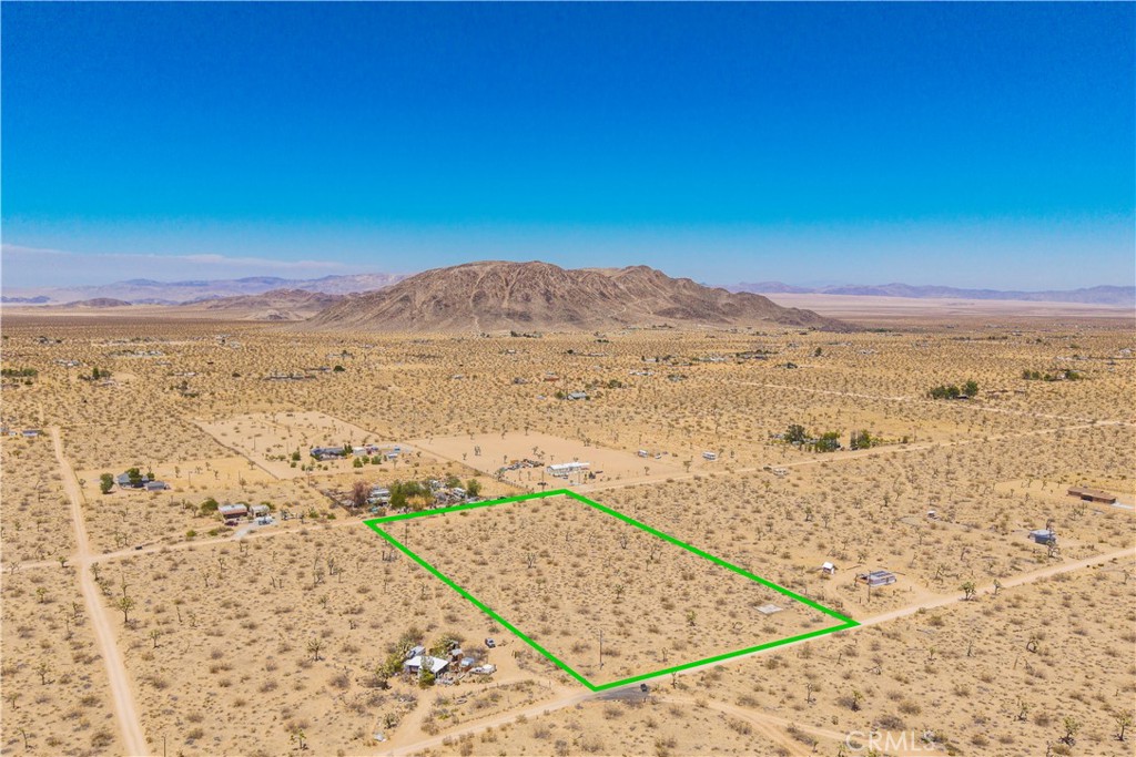 Flat and buildable 5-acre parcel in Landers with water in the street and an existing concrete slab from a former cabin. This property is ready for your vision, whether you're building a full-time residence, vacation home, or investment project. Located on a quiet street with nearby homes, you’ll enjoy both privacy and a sense of community. The old cabin slab adds character and potential for reuse or new construction. Power appears to be nearby, and the wide-open desert views offer endless inspiration. Landers is a growing area known for its peaceful setting, starry skies, and proximity to Joshua Tree National Park. Don’t miss this opportunity to secure a spacious, utility ready parcel in one of the High Desert’s most desirable up-and-coming locations!