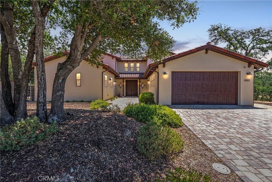 Welcome to a truly exceptional opportunity at Via Marbella, a stunning newer construction home within Atascadero's highly sought-after Cerro Roble development. This home is uniquely situated on one of the most expansive lots in the neighborhood (nearly a half acre), granting unparalleled privacy and elbow room—a rare commodity in Central Coast living! Step inside and be greeted by the stunning flow of the open floor plan, immediately enhanced by soaring ceilings, a sun-drenched double-door entry, and gorgeous luxury wide plank flooring that stretches throughout the main areas. Architectural details, including elegant bullnosed arches and a railed staircase, showcase the home's meticulous craftsmanship. The gourmet kiountertops, a timeless farmhouse sink, exquisite custom hardware, and upgraded appliances perfect for effortless culinary creation and hosting. Retreat to your serene, main-floor Primary Suite, a private oasis boasting a massive walk-in closet and a spa-like en suite with a custom tiled, walk-in shower. Upstairs, versatility reigns with an extended-size Bonus/Flex Room—a generous space ready to be transformed into your ideal home theater, dedicated office, or private gym. Outside, your private, oversized lot is an invitation to outdoor living, featuring over $10,000 in custom pavers and expansive, low-maintenance turf. Location is paramount: the convenience is unmatched as you are positioned just minutes from the world-class wine country of Paso Robles and the vibrant culture of San Luis Obispo. Complete with an essential indoor laundry room and a comprehensive alarm system and fire sprinklers for peace of mind, this home is ready to be claimed. Opportunities to own a home of this caliber and lot size in Cerro Roble are exceptionally rare—act decisively and schedule your private showing today to start living the life you deserve!