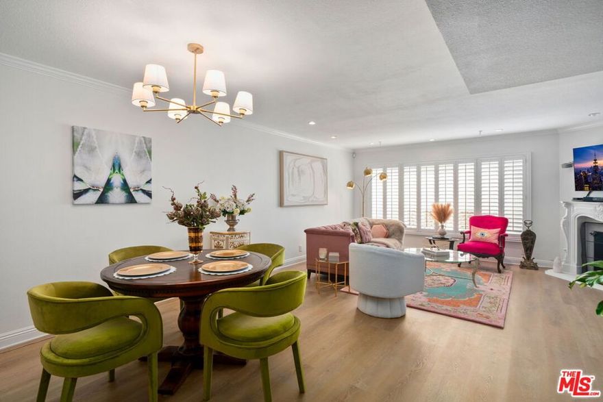 Sophisticated Turn-Key Townhouse in Studio City. This elegant townhouse blends modern luxury with timeless design, just steps from Tujunga Village and minutes from major studios. The open-concept main level showcases a kitchen with hand-carved granite, custom cabinetry, and top-of-the-line appliances.  Flow into a light-filled dining and living area with a cozy fireplace, recessed lighting, and vinyl plank floors throughout. A stylish powder room completes the first level.Upstairs, two en-suite retreats offer comfort and sophistication. The primary suite features vaulted ceilings, a walk-in closet, French doors to a private balcony, and a spa-inspired bath with a clawfoot tub and travertine stone throughout. The second suite has plenty of natural light, ample closet space, and walk-in rainfall shower elevated with a glass block wall & classic subway tile.Additional highlights include; in unit washer & dryer, copper plumbing, plantation shutters, retractable screen doors, custom blinds, 2 car subterranean parking, and additional storage unit in garage move-in ready in one of Studio City's most desirable locations. Can be delivered furnished.