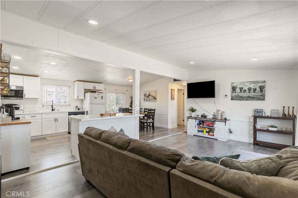 Set against the striking backdrop of the Mojave Desert, this beautifully updated 3-bedroom, 2-bathroom modern home offers the perfect blend of comfort, simplicity, and desert charm. With 1,152 square feet of thoughtfully designed living space on a 12,317 sq ft lot, there's plenty of room to enjoy both indoors and out.
Inside, you’ll find a light-filled, open-concept layout, featuring clean lines, neutral tones, and polished finishes that embrace the modern desert aesthetic. The living room flows effortlessly into the kitchen and dining area—ideal for entertaining or quiet evenings at home. The kitchen features sleek cabinetry, modern appliances, and minimalist hardware, all designed with functionality and style in mind.
The primary suite includes an en-suite bathroom. Two additional bedrooms provide space for guests, a home office, or creative studio. Both bathrooms are updated with contemporary fixtures and smart, water-efficient features.
Outside, the home sits on a generously sized, fully usable lot—perfect for adding a pool, a desert garden, or creating your private outdoor retreat. The landscape is native and low-maintenance, embracing the raw beauty of the high desert. You might enjoy stargazing from a patio, soaking in a hot tub under the Milky Way, or watching the sunrise over nearby Joshua Tree National Park.
With a peaceful neighborhood, yet close to local shops, cafes, and the entrance to the national park, this property is ideal for full-time living. Schedule a house tour today!