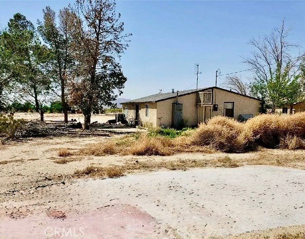 Welcome to 34774 Old Woman Springs Rd, a unique opportunity with endless potential nestled in the heart of Lucerne Valley. This expansive property sits on a generous parcel of land and features multiple structures, offering incredible flexibility for a variety of uses—whether you're looking to create a private retreat, multi-family setup, or investment opportunity. While some updates and improvements may be needed to make it truly your own, the possibilities are wide open. With its vast open space and serene desert surroundings, this property is perfect for those with a vision and a desire to customize.