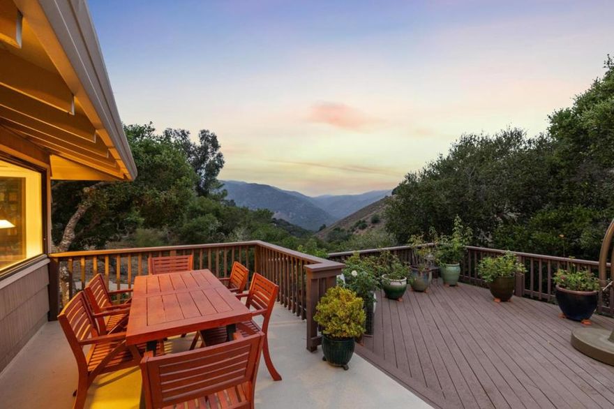 Welcome serene living in this Carmel Valley gem, offering breathtaking views of the oak-studded Santa Lucia Mountains. The views are mesmerizing and turn sunsets into real life paintings. This gracious four-bedroom, three-bathroom residence is designed to enhance the seamless indoor-outdoor lifestyle that the area's perfect climate provides. The gourmet kitchen opens to a sunlit patio, perfect for morning relaxation. Enjoy the spacious living room featuring a luxurious fireplace, mountain views, and dual sets of French doors leading to an extensive deck with southern exposure. The main floor features a lovely owner's suite, two guest bedrooms, and light filled reading room, all adorned with rich oak hardwood floors. The lower level boasts a private en-suite with its own entrance from the patio area. It connects to a flex space that is perfect for a home office  or gym.  The gardens are lush, filled with native drought tolerant plants that thrive in the valley climate, and garden beds that are bursting with the season's best all year. Conveniently located near the amenities of Carmel Valley Village, endless hiking trails of Garland Regional Park and just over 5 minutes from Mid-Valley. This residence offers an unparalleled lifestyle amidst lush gardens and tranquil surroundings.