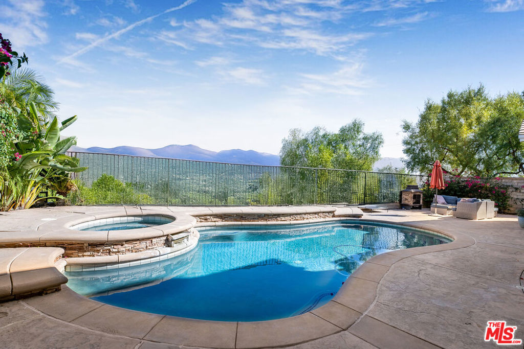 Welcome to an extraordinary 4-bedroom, 3-bathroom home nestled on a prime corner lot in the highly sought-after Saugus Union School District. Spanning 3,026 square feet, this open-concept home blends sophistication and comfort with a seamless flow perfect for both family living and stylish entertaining. The resort-style backyard is a true haven, featuring a sparkling swimming pool, relaxing jacuzzi, and inviting outdoor firepit, ideal for soaking up the California sunshine or unwinding under the stars. Four generously sized bedrooms and three impeccably designed bathrooms provide ample space for everyone, ensuring both privacy and functionality. Located in a tranquil, pet-friendly neighborhood with nearby parks, pets are welcome with a pet deposit. Don't miss your chance to call this exceptional property home.