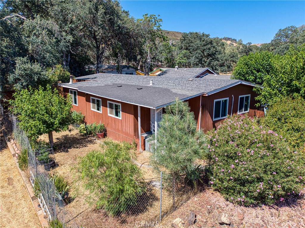 This completely remodeled 3-bedroom, 2-bathroom home at 16080 40th Ave offers 1,440 square feet of comfortable living space on four combined lots. The property features abundant kitchen cabinets, laminate flooring throughout, and a tile shower in the master bathroom. Every room includes mini-split systems for year-round comfort.
The home showcases quality construction with newer windows throughout, a newer roof, and a wood stove for cozy evenings. A 433A foundation certificate is on file, confirming the structural integrity. Covered porches span both front and back, perfect for outdoor relaxation.
The expansive lot provides exceptional outdoor space with mature landscaping and a fully fenced yard. An oversized garage offers ample storage, while the concrete driveway ensures easy access. A side concrete pad stands ready for an additional garage if needed.
This unique property includes two addresses within the four lots, creating potential for an accessory dwelling unit (ADU). A large empty lot adjacent to the main house presents opportunities for new construction, offering flexibility for future expansion or investment.
Convenient amenities nearby include Foods Etc grocery store just over a mile away, Redbud Park for recreation, and Walmart for shopping needs. Lower Lake High School serves the area's educational requirements.
The concrete driveway and fully fenced yard provide security and easy maintenance. This well-appointed home combines modern updates with practical outdoor space, making it ideal for those seeking room to grow in Clearlake's peaceful setting.
