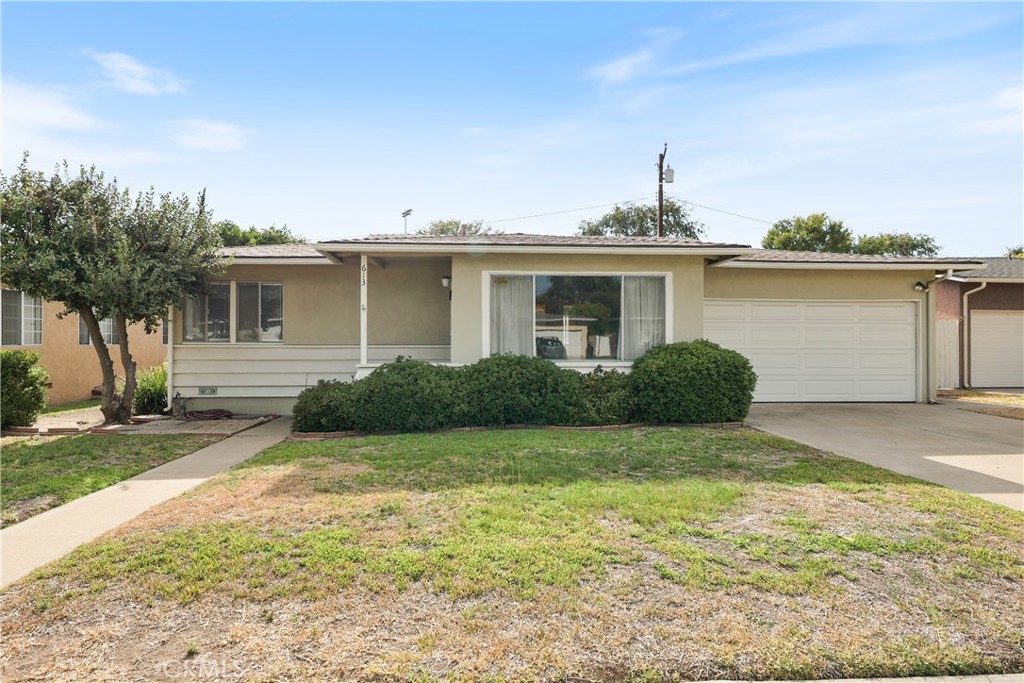 Located in the well-known Christmas Ball neighborhood, this home has all the charm and traditional style you'd expect from a 1950's home. As you enter the home, you'll see a big picture window that brings in lots of natural light and gives that feeling of openness to the room. The living room seamlessly connects to the dining room giving you that open-concept feel. The kitchen is light and bright with a big pantry, direct access to the garage, and seating for a booth. The bonus room was added after original construction, but in the 1950s and has a gas-burning fireplace, direct access to the backyard, and plenty of room for entertaining. All the bedrooms have ceiling fans, big windows, and lots of potential. The backyard is perfect for pets, entertaining friends and family, and relaxing after a long day. Upgrades include a newer roof, water heater, drain pipes, and the sewer has been lined. Conveniently located to CSUF, Fullerton College, Hope International University, Downtown Fullerton and the Fullerton Train Station. This home is ready for you to make it your own.