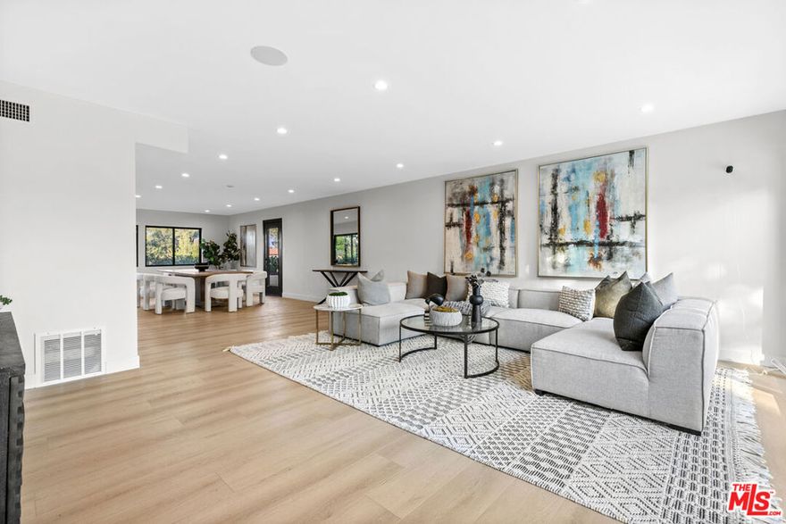 Welcome to your dream rental in Woodland Hills, CA. This fully remodeled modern home offers 2,745 sq ft of refined living space, ideally situated south of Ventura Boulevard on a quiet street with homes on only one side, providing unmatched privacy in one of the Valley's most desirable neighborhoods.Inside, the residence features four bedrooms and three bathrooms, including two spacious primary suites and a versatile main-level bedroom perfect for guests or a home office. The open floorplan is filled with natural light and highlights a chef's kitchen with custom white oak cabinetry, high-end stainless steel appliances, minimalist finishes, and a flip-up window that opens to a backyard bar for effortless indoor-outdoor entertaining. Light hardwood floors, generous closet space, and tranquil hillside views create a seamless blend of comfort and style.Step outside to your private resort-style oasis with a sparkling heated pool, dry sauna, grassy lounge, and a custom glass-covered gazebo surrounded by mature landscaping, offering the perfect setting for both quiet relaxation and memorable gatherings.This home is complete with modern conveniences including an EV charging station, a finished two-car garage, a new central HVAC system, and integrated smart lighting with built-in surround sound. Conveniently located near The Village at Westfield Topanga, Ventura Boulevard dining, Trader Joe's, Sprouts, and Amazon Go, with easy access to the 101 freeway and only 20 minutes to Malibu beaches, this home offers the ideal balance of luxury and location.Don't miss the rare opportunity to rent a turnkey, resort-style pool home south of Ventura Boulevard in Woodland Hills.