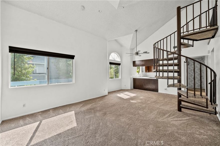 Top floor 3-bedroom + upstairs Loft (currently set up as an office), 2 bath, townhome perched at the top level of American Beauty neighborhood with awesome views from the balcony. Freshly painted, the inviting open living room features newer carpet and a focal fireplace and seamlessly joins the open dining area. The kitchen with plenty of storage and counter space comes complete with new microwave, stainless steel appliances, 5-burner range, newer Bosch dishwasher, and refrigerator with built-in water dispenser. The primary bedroom with attached bathroom and secondary bedrooms have ceiling fans, and window blinds. The spiral staircase takes you up to the versatile loft which is set as an office but could be a 4th bedroom/playroom. For your convenience, there is a 3-months newer stackable washer/dryer (Wi-Fi enabled) inside the townhome and 2-car tandem garage with plenty of ceiling shelves and work-table. Park-like surroundings with community pool, tennis court, playground and guest parking. Conveniently located off Soledad Canyon between Golden Valley Road and Whites Canyon, nearby to public transportation, shopping center, restaurants, Costco and all the conveniences SCV has to offer.
