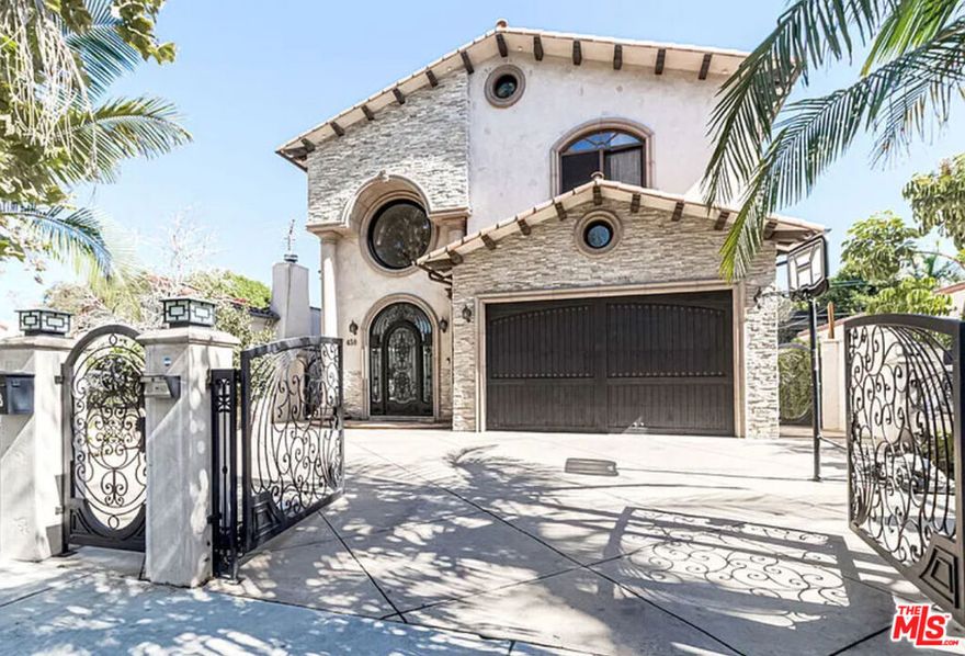 Stunning contemporary Mediterranean with extraordinary quality and detail throughout. Grand entry with an open floor plan featuring a true chef's kitchen, a great living room, an entertainment space, and a dining room. Spacious bedrooms and baths with custom closets and a terrific balcony off the master overlooking the pool. Hardwood and tile floors throughout, outdoor shower, and spa with LED lighting.