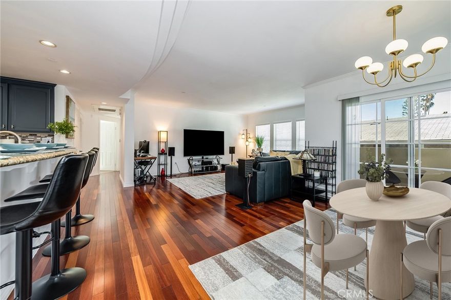 Welcome to this top-floor stunner in a boutique 15-unit Mediterranean-style building with an open-air courtyard, right in the heart of Valley Village! This bright and airy 2-bedroom penthouse is full of charm, flooded with natural light from skylights throughout and warm wood floors underfoot. The updated kitchen shines with stainless steel appliances, new fixtures, and refinished solid wood cabinets. One bedroom includes a spacious walk-in closet, and both feature brand-new carpet. A smart home setup offers voice-activated lighting, an Ecobee thermostat, smart lock, and video doorbell—modern convenience at its finest. Enjoy the ease of an in-unit washer/dryer combo and your own private outdoor space. Gated, assigned underground parking is included. All of this in an unbeatable location close to shops, restaurants, and everyday essentials, with easy access to major studios and the Westside. Located in the highly regarded Colfax Elementary School district (buyer to verify).

This is Valley Village living done right!