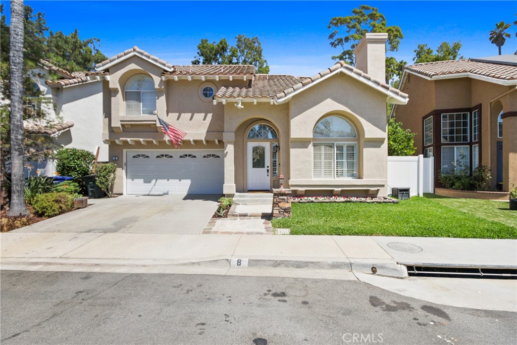 Beautiful Foothill Ranch 3 bedroom, 3 bath, 2 car garage, single family residence home. This property features a bright and open floor plan with plenty of natural light, soaring ceilings, elegant wood floors, brand new upgraded carpet, custom painting throughout home, plantation shutters, dual pane windows, gourmet kitchen with granite counter tops/backsplash, stainless steel appliances, bar seating with a breakfast nook that opens to a spacious dining area and an adjoining living room with a nice and cozy fire place. Also featuring a large primary suit with vaulted ceilings and a remodeled bathroom with an oversized soaking bathtub and shower. Spacious secondary bedrooms … and don't forget about the beautiful upgraded double pane sliding door leading out to an entertaining backyard with a custom bar and BBQ for those summer evenings with friends and family. This property is located on a cul-de-sac street within a just a short walk to parks, pools, and award-winning Foothill Ranch Elementary school, shopping centers, dining and entertainment, close to freeways. This property is a must see. Bring your fussiest buyers. Hurry this property won't last!