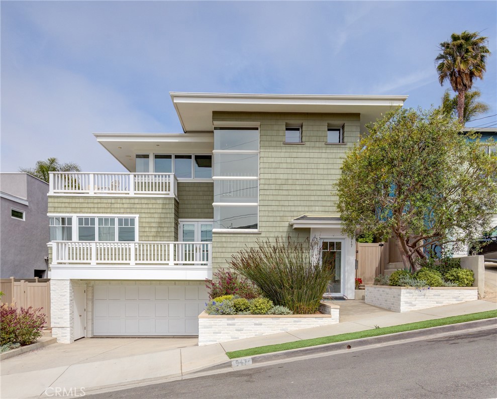 Welcome to this fresh, modernized Cape featuring four bedrooms and four baths plus rooftop deck, designed in 2007 by Michael Lee. Four bedrooms and four baths are offered in 3329 square feet on a 4502 square foot lot, boasting hardwood floors throughout, custom architectural detail and loads of natural light. The home has many additional amenities, including a Tesla charger and a whole house water purification system. The first floor includes a laundry room with sink and large storage closet. The second floor’s private living quarters embrace form and function, with four spacious bedrooms including a lovely primary suite with fireplace and private patio, three full baths, a wet bar with mini fridge, generous bedrooms, and a bonus room. The top floor is vast and inviting with beamed ceilings, tons of windows and polished hardwood floors. A gorgeous Chef’s kitchen includes marble countertops, paneled and stainless appliances, two sinks, statement pendants, and a handy wine fridge. An adjacent sunny living room opens onto the wide top deck, where dining al fresco or relaxing in the sun is almost required! The dining area is cozy with corner windows and is situated to take advantage of the fireplace, serving both the eating area and tucked-away family room. Here, you can gather with friends and family to watch the big game, or step outside and up to the rooftop deck, which has both an inviting fireplace and custom pizza oven. Entertaining guests has never been easier - escape to the roof to relax, recharge, and enjoy your beautiful Hermosa Beach home.