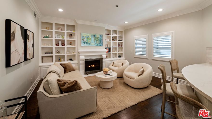 This beautifully appointed 2 bedroom, 2 bath, 1,569 sq. ft. condo sits on a quiet, tree lined street in one of West LA's most coveted neighborhoods. Recently remodeled, it blends the comfort of a 5 star hotel with the convenience of being just moments from Westwood Village and Century City.Set within a secure, newer-construction Mediterranean building, residents are welcomed through an elegant open-air courtyard with a charming fountain an immediate glimpse of the lifestyle within. Inside, a formal foyer opens to a spacious kitchen, family room, and living area designed for both everyday comfort and effortless entertaining. Two bedrooms are thoughtfully placed on opposite ends of the home, including a primary suite with abundant closet space, a spa-like bath with soaking tub, and direct access to the expansive covered patio. Every main room flows outdoors, creating a seamless indoor-outdoor experience perfect for morning coffee or evening gatherings.Rich hardwood floors, crown moldings, graceful arches, and beautifully restored tilework are enhanced by tall ceilings, natural light, and luxurious finishes.Residents enjoy a well-managed, secure community with gated underground parking (two tandem spaces plus guest parking). Whether savoring quiet mornings on your patio or stepping out to LA's premier shopping, dining, and cultural destinations, this home offers a lifestyle where every day feels elevated.