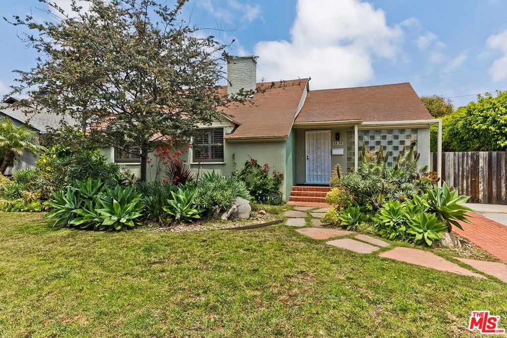 Gorgeous home in the prestigious Westdale-Trousdale neighborhood! This traditional 1-story home has a bright living room with an incredible oversized skylight, beautiful hardwood floors, fireplace, and a wall of floor-to-ceiling sliding glass doors that open to the semi-covered patio. The gourmet kitchen has wood cabinetry, granite counters, professional grade range, stainless steel appliances and opens to the dining room. The primary suite has a separate sitting room with a glass enclosed writer's space surrounded by nature. This amazing workspace, with floor to ceiling windows, is the perfect spot for an artist. The large backyard is surrounded by tall hedges creating a completely private space with fruit trees, a tranquil sitting area, raised garden and large grass yard. The detached garage would make a great workshop or gym or could be converted into an ADU. Fantastic Westside location in Mar Vista with access to Mar Vista elementary, surrounded by shops & restaurants, near Mar Vista Park and Whole Foods!