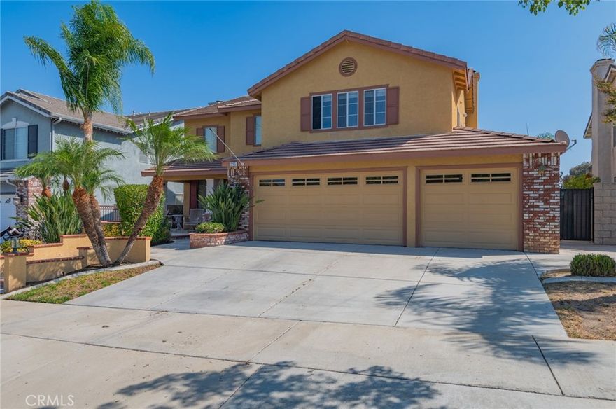 Beautiful Turnkey home has a large Rock outdoor fireplace, built-in BBQ, a covered patio that runs the length of the house all on a large flat lot with block walls around the entire lot and no neighbors behind you and a city view -- perfect for entertaining and those summertime BBQs! As you walk inside this home there are dramatic soaring cathedral ceilings and the inside has been totally upgraded with Travertine flooring throughout the downstairs, custom Wood staircase and stairs, plantation shutters throughout the house, remodeled kitchen with granite counter tops, custom built-ins around the granite woodburning fireplace in the large family room. There are a downstairs bedroom and bathroom, three car garage and an indoor laundry room downstairs. The master bathroom has been completely remodeled with a soaking tub, separate shower with custom tile, dual sinks with granite counter tops, there are two additional bedrooms with a bathroom plus the master bedroom and a large bonus room upstairs. it is perfect home for a family. it will not stay long on the market!