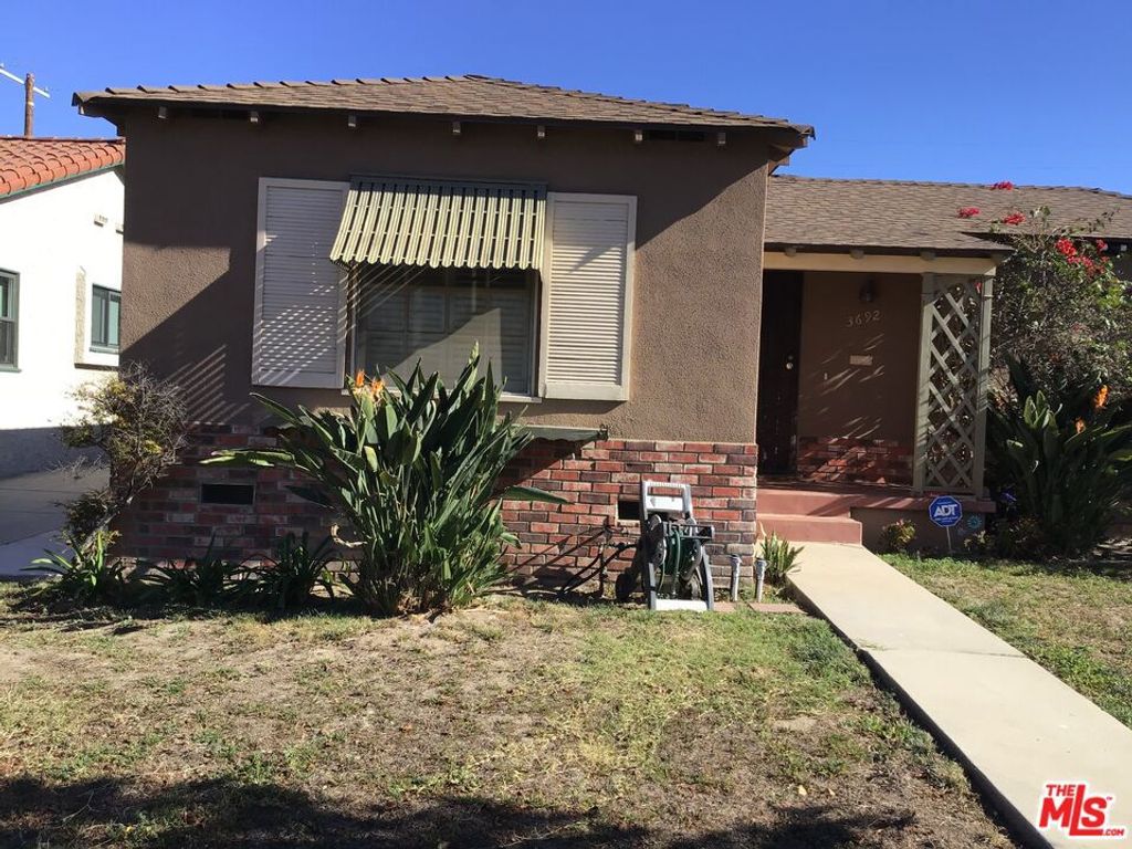 Photo of 3692 Buckingham Road, Los Angeles, CA 90016 (MLS # 25592639)