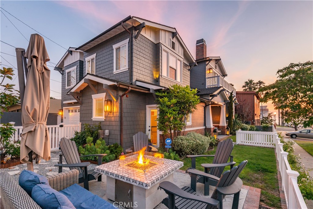 Nestled just a block from the vibrant Riviera Village, Esplanade, and the beach, this Coastal Craftsman home embodies the essence of a classic beach house. With soaring ceilings and hardwood floors throughout, the open, flexible floor plan allows for seamless living and entertaining. The dual-sided fireplace connects the inviting living room and formal dining room, creating a warm and welcoming atmosphere.
The gourmet kitchen, complete with stainless steel appliances, flows effortlessly into the expansive family room, which also features a cozy fireplace, perfect for gathering. A separate breakfast room offers an intimate space for casual dining. The relaxing primary suite offers a peaceful retreat, while the oversized lower-level guest bedroom—easily adaptable as a second family room—adds extra flexibility.
Enjoy ocean breezes and panoramic views from the stunning roof deck, the perfect place to unwind after a day at the beach. The outdoor fire pit in the enclosed front yard creates an ideal space for entertaining under the stars.
Additional features include a 2-car garage with room for 3 cars in the driveway and central air-conditioning, ensuring comfort year-round. This home is the epitome of coastal living, combining comfort, style, and location to create a truly exceptional lifestyle.
