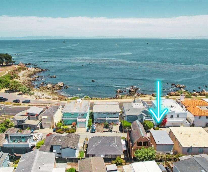Perfectly situated just steps from scenic recreation trails and Lovers Point, this charming two-story Pacific Grove retreat offers a glimpse of the ocean and the calming sounds of waves to help you unwind. Clever use of space to ensure every square inch is functional and inviting. The charming kitchen features classic design with efficient appliances and a central island, creating a warm and inviting space to prepare meals and gather with loved ones. Downstairs radiant floor heating, ensuring warmth and coziness. The upstairs primary bedroom, freshly painted, is filled with natural light from expansive windows, creating an airy and welcoming atmosphere. With new plush carpeting, a recently installed roof, and all systems in excellent condition, this turnkey home is perfect for weekend escapes or a cozy starter residence.