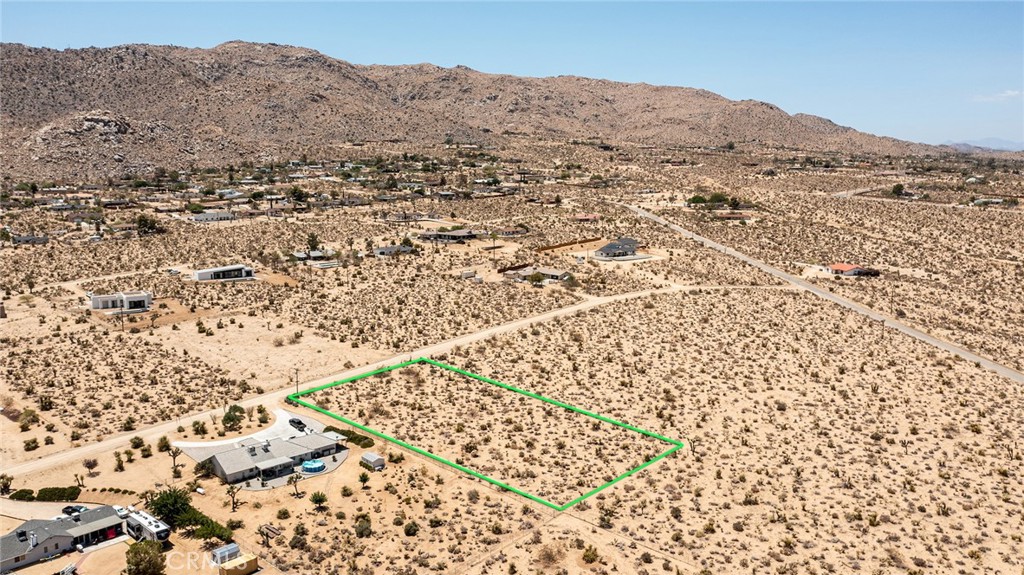 Pristine 1.14-Acre Hillside Parcel: Located in Upper Friendly Hills with water and electric in the street. Walking distance to the Nature Preserve and only a short distance further to Joshua Tree National Park. Commanding views of both the Basin below and the ridgelines of the Park above. Architectural Plans & Structural Design Report has been completed and simply need to be submitted to County for approval. Contact agent for plans and supplements. APN: 0588-252-08