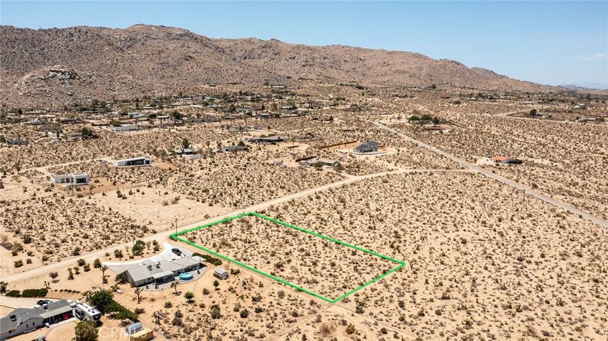 Pristine 1.14-Acre Hillside Parcel: Located in Upper Friendly Hills with water and electric in the street. Walking distance to the Nature Preserve and only a short distance further to Joshua Tree National Park. Commanding views of both the Basin below and the ridgelines of the Park above. Architectural Plans & Structural Design Report has been completed and simply need to be submitted to County for approval. Contact agent for plans and supplements. APN: 0588-252-08