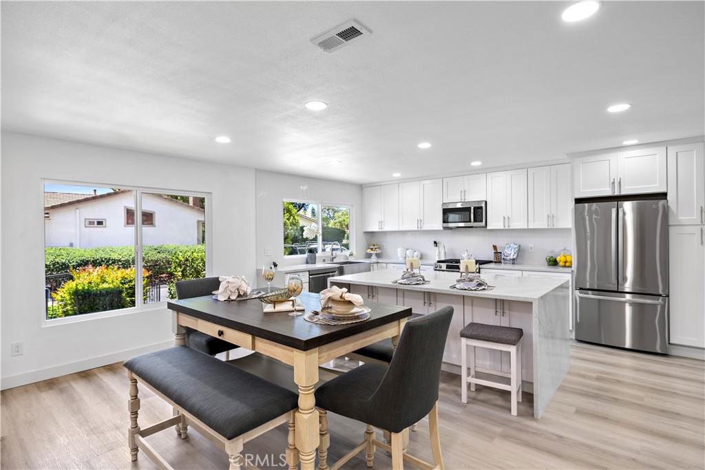 Exceptional Remodeled Retreat on a Private Cul-de-Sac. Welcome to 23902 Via Lugones, a beautifully upgraded custom Elena model nestled in a serene, secluded location on a peaceful cul-de-sac. This thoughtfully remodeled home offers approximately 1,400 square feet of elegant living space, designed for both comfort and style. Featuring two spacious bedrooms, two full bathrooms, and an attached garage, this home is a true gem. Step inside to discover a stunning, open-concept kitchen with a large center island, all-new custom cabinetry, quartz countertops, and stainless-steel appliances, including a brand-new refrigerator. The kitchen flows seamlessly into the expansive living area, creating a light-filled great room ideal for entertaining or relaxing. The primary suite offers a luxurious retreat with a beautifully remodeled en-suite bath, complete with double sinks, a custom walk-in shower featuring multiple showerheads, and a frameless glass enclosure. The second bathroom has also been tastefully remodeled with a new vanity and walk-in shower. Upgrades throughout the home include wide-plank vinyl flooring, LED recessed lighting, new baseboards, mirrored closet doors, and custom closet organizers. Every detail has been considered—from the new doors and hardware to the comprehensive whole-house repipe—providing peace of mind and modern convenience. Enjoy indoor-outdoor living with a large, enclosed patio, perfect for quiet mornings or evening gatherings. Located in a premier 55+ community set on 484 acres of rolling hills and mature trees, residents enjoy resort-style amenities including:
Two recreation centers
Pickleball, tennis, lawn bowling & sport courts
Swimming pool, spa & gym
Clubhouse, billiard room & more
HOA-covered front yard maintenance, trash, exterior painting, and common area upkeep. As a member of Lake Mission Viejo, you'll also enjoy access to swimming, fishing, boating, and lakeside picnics.
23902 Via Lugones isn’t just a house—it’s a tranquil, upgraded haven in one of the most desirable 55+ communities. Come experience the lifestyle you’ve been waiting for.