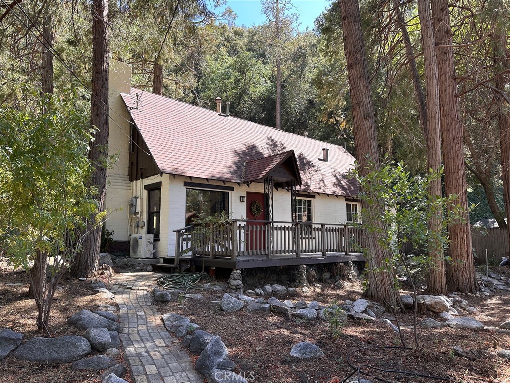 Life in the lower Canyon where the living is easy! Street appeal is what you see in this freshly painted, Well loved and beautifully remodeled 3 bedroom 2 bath home. Living room boasts Olympic wood burning stove in brick fireplace and a MR COOL split unit for heating and air. Modern meets old school when the original brick is revealed under stucco coating creating this Industrial chic look. Barn door leads from living room into main floor master with ensuite bath and access to huge rear yard. Kitchen is a chefs delight with dark granite counter tops and bright white new cabinets, big efficient dual glazed windows let the light shine. Adjacent service porch allows access to laundry, bath and side yard. Upstairs hosts tons of storage, sitting area/family room, kids size bedroom and big bedroom, with skylights and a full bath. Huge front yard and off street garage create tons of parking and room for gardening to your Hearts delight. Big Front porch for sitting, rocking and watching the world go bye. Property already well landscaped including mock orange, Camellias, fruit trees and so much more. This one of a kind home sits on the top part of the Prospect loop so walking, bike riding and socializing with neighbors is a breeze.