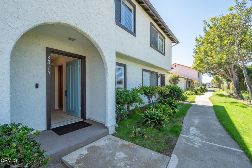 Professional Photos will be available on Wednesday, September 10. The front photo is a Zillow Photo.Welcome to 3215 Kelp Lane in the desirable Mandalay Beach Townhomes community of Oxnard. This two-story condominium offers 2 bedrooms, 1.5 bathrooms, and 1,051 sq. ft. of comfortable living space.Step inside to a bright and open living area featuring a cozy wood-burning fireplace, creating the perfect focal point for relaxing evenings. The living room flows into the dining space and kitchen, which includes warm wood cabinetry, ample storage, and a functional layout ideal for daily living and entertaining. Upstairs, you'll find two spacious bedrooms with generous natural light and a full bathroom. A private patio provides an inviting outdoor retreat, perfect for barbecuing or lounging, with direct access to the detached two-car garage.The Mandalay Beach Townhomes community has recently undergone significant updates, including a fresh exterior repaint, new roofs, and slurry-sealed asphalt. Residents also enjoy a variety of amenities, including a swimming pool, spa, tennis courts, and RV storage.Conveniently located near local beaches, shopping, dining, and coastal lifestyle attractions, this home offers an excellent opportunity for those seeking both comfort and value in a well-maintained community.