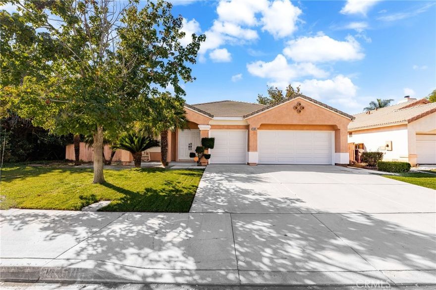 Welcome home to this beautifully maintained single-story residence tucked inside Moreno Valley’s sought-after Victoriano community. From its inviting curb appeal to its bright, open interior, this home delivers warmth, comfort, and style in every corner. Step through the double-door entry into a spacious open-concept floor plan where the living and dining areas flow seamlessly together — perfect for family gatherings and entertaining guests. Large windows and neutral tones fill the space with natural light, while tile flooring adds a clean, modern touch. The remodeled kitchen is the heart of the home, featuring rich wood cabinetry, granite countertops, stainless-steel appliances, and a movable center island. Overlooking the cozy family room, this space invites connection and relaxation. The family room showcases a beautiful stacked-stone fireplace, custom built-in shelving, and French doors that open to the backyard — creating the ideal indoor-outdoor experience. Your primary suite offers a peaceful retreat with warm wood-style flooring, ample space for a sitting area, and a private ensuite complete with a soaking tub, separate shower, and dual-sink vanity. Two additional bedrooms provide flexibility for guests, a home office, or growing family needs. Outside, enjoy a low-maintenance yard with mature trees offering shade and charm, while the three-car garage provides plenty of parking and storage. Located near top-rated schools, parks, shopping, and easy freeway access, this move-in-ready home perfectly blends convenience with everyday comfort. This one will go fast so SCHEDULE YOUR SHOWING TODAY!