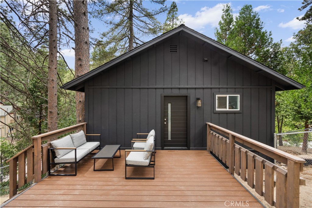 Tucked away in the heart of Twin Peaks, Elysian Hill is a stunning, fully remodeled Japandi-inspired cabin that offers the perfect blend of modern sophistication and serene mountain living. This 2-bedroom, 1-bath retreat is not only an idyllic personal escape but also a highly-rated, turnkey investment property. With its beautifully renovated interior, Elysian Hill features a striking Tadelakt bathroom, showcasing artisan craftsmanship and a smooth, luxurious finish. Every detail throughout reflects a dedication to quality, from the hand-crafted wood accents to the clean lines of the open-concept living area. The floating Swedish fireplace adds both warmth and elegance to the space, making it the ideal spot for relaxation. The modern kitchen is equipped with high-end appliances, custom cabinetry, and sleek countertops, making it a perfect space for both cooking and entertaining. Your private back deck offers a tranquil oasis perfect for enjoying the natural beauty of the surrounding landscape. Perfectly located between Crestline and Lake Arrowhead, you can easily enjoy the best of both worlds.With a driveway offering off-street parking and Level 2 ChargePoint EV charger , the property combines privacy, convenience and accessibility. Elysian Hill is the perfect turnkey investment opportunity, ready to welcome guests or serve as your personal sanctuary. Whether you’re seeking to invest in a highly-rated rental property or a peaceful retreat, this finely cultivated cabin delivers on both fronts, combining the best of modern luxury with mountain tranquility.