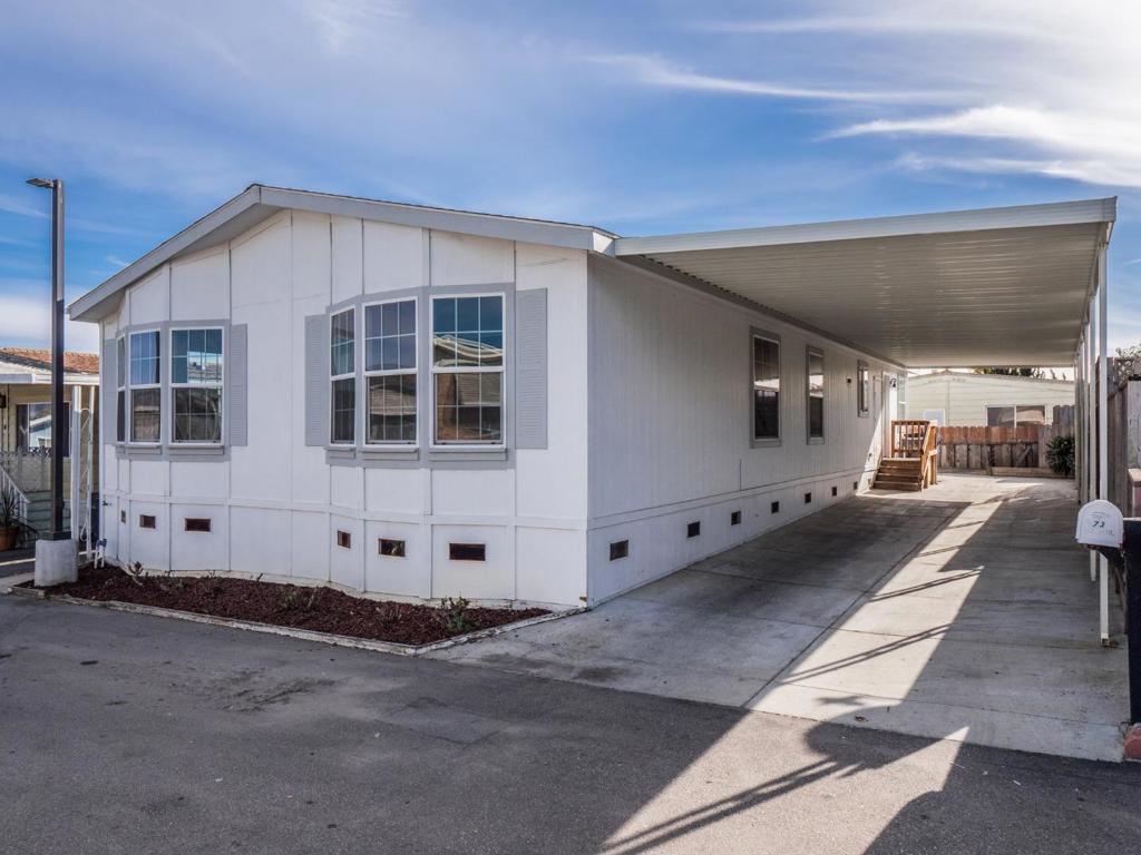 Located in Rancho Cerritos, an all-age park with a pool and clubhouse. The Master Suite is located opposite the 3 guest bedrooms, creating a perfect living arrangement for a big family, multi-generational household, or simply those needing some separation of space. The Master has a walk-in closet and large bathroom with double vanities, stall shower, and deep soaking tub. The spacious kitchen has a new stainless steel range and lots of cabinet and counter space. There are two living spaces with a family room off the kitchen and dining area and a separate living room. Recently spruced up for the next owner with all new interior paint and carpet. Utility room has laundry hook ups and pantry. Covered carport parking can accomodate 2+ cars. An affordable option for living in Santa Cruz County. With low space rent, home ownership can be more affordable than renting.