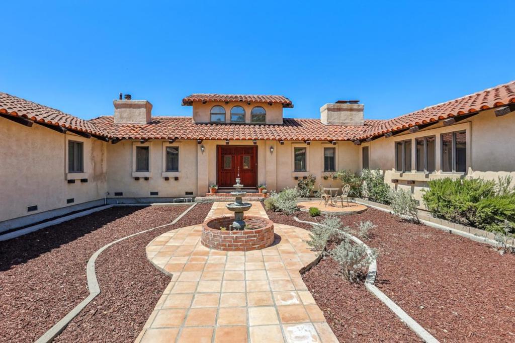 Luxury Live Auction! Bidding to start from $1,100,000.00! Unmatched value in Los Gatos! Perched on a scenic ridge, this Spanish-inspired estate captures sweeping 360 degree views of Santa Clara Valley and even out to the Pacific. The open layout with soaring ceilings combines elegance and comfort, filling every space with natural light through walls of windows that frame breathtaking vistas. Offering 5 bedrooms plus a dedicated office/den and 2.5 bathrooms, this home provides generous living and entertaining space. The expansive living and dining area features vaulted ceilings, a cozy fireplace, and sliding doors to the outdoors. The chefs kitchen is equipped with abundant counter space, built-in oven, electric cooktop with grill, pantry, and a compactor. The primary suite opens to stunning valley views and includes dual walk-in closets and a spa-style bath with double sinks, soaking tub, & separate shower. Two additional bedrooms could easily be converted into ensuite retreats. Set on 5 sunny acres, the property also includes a barn (with ADU conversion potential), riding trail access, RV parking, & a 3-car garage. Excellent water supply, Starlink satellite internet, and highly regarded Los Gatos schools. Lexington Elementary, Fisher Middle, & Los Gatos High add to the appeal.
