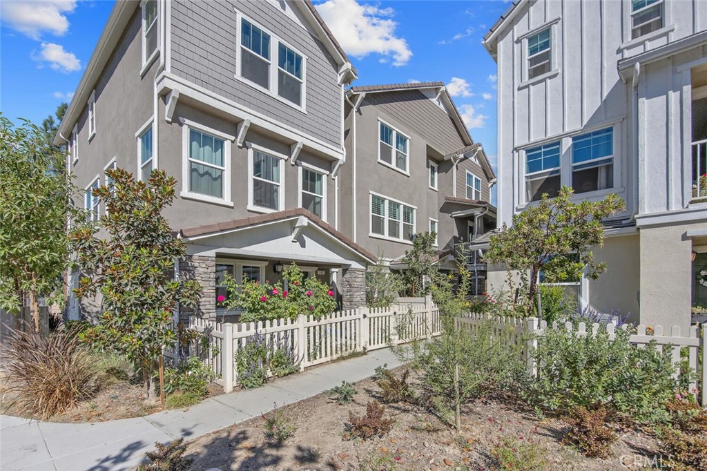 Welcome home to this beautiful cozy and quiet tri-level townhome in the up and coming community of Citrus Grove in Fillmore - featuring 3 bedrooms and 2.5 baths. Upon entry you are greeted by a light and bright flex space ideal for a home office, game room, gym or creative space Which is also conveniently attached to the two car garage! Upstairs you will find an open-concept, regal living space that is ideal for entertaining with a beautifully upgraded kitchen boasting timeless quartz countertops, crisp white cabinets, stainless steel appliances, plantation shutters, sweeping center island with storage on each side both convenient and ideal for those holiday dishes you only use once a year and an extensive walk in pantry with enough room for food storage as well as appliances to hide away! The living room looks out onto the neighborhood and conveniently opens to the kitchen and entertainment niche as well as half guest bathroom! On the upper level, you will find 3 spacious bedrooms with mirrored closet doors, including a primary retreat with picturesque mountain views in the distance. Luxury vinyl plank flooring, plush carpet, neutral paint, plenty of storage and great natural light plus additional highlights such as leased solar, tankless water heater, a two-car direct access garage with extra storage which can be used for luggage, bikes, miscellaneous boxes and a faucet which makes washing anything outside very convenient. The charming curb appeal throughout the community welcomes you with it’s inviting impression, including gated front patio are! HOA amenities include a sparkling pool which is just a short walking distance but no noise from the pool area in your quiet living space, BBQ area, ample guest parking and even a play area! Plenty of scenic walking and biking trails built for the community neighborhood. Located just minutes to downtown Fillmore, restaurants and shopping and located between LA and Santa Barbara with just a short distance to Santa Clarita - this is a home you will cherish for years to come!