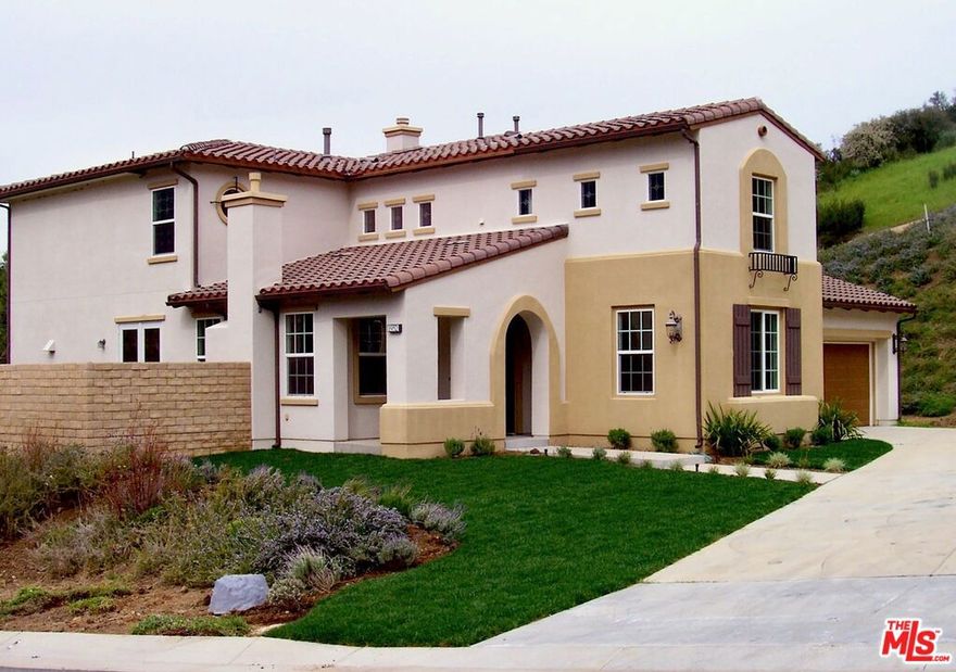 Discover this beautiful Spanish-style home on a corner lot in the coveted Malibu Canyon area of Agoura Hills. This stunning 4-Bedroom (plus a convertible office/5th bedroom), 5-Bathroom residence is perfectly located, just minutes from the beaches of Malibu, the rustic charm of The Old Place and The Road Store, and downtown Agoura Hills. The home's authentic Spanish aesthetic is enhanced inside with rich, dark Eucalyptus Hardwood and elegant Tumbled Travertine flooring, and features a custom Wrought Iron and Wood staircase. The upgraded kitchen is a chef's delight with a Wolf range/oven and wine refrigerator. Complete with an upstairs recreation room/media center, custom closet built-ins, and a four-car tandem garage, this is the perfect family home. Step out to the spacious backyard, ready for your family to take in gorgeous canyon sunsets. More photos to come.