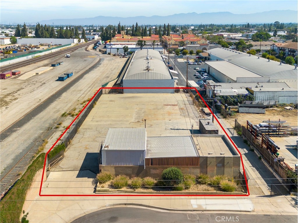 Opportunity to lease a +/- 20,000 sf industrial zoned lot with small office. Property is well-suited for contractors, service providers, or similar industrial users. The property has a +/- 651 SF one-story office—perfect for administrative work and storage. Adjacent to the office is a large 1,581 SF metal-covered area ideal for parking, storage, or workspace, with truss heights ranging from 10 to 15 feet to accommodate vehicles and equipment. The yard is secured and paved.