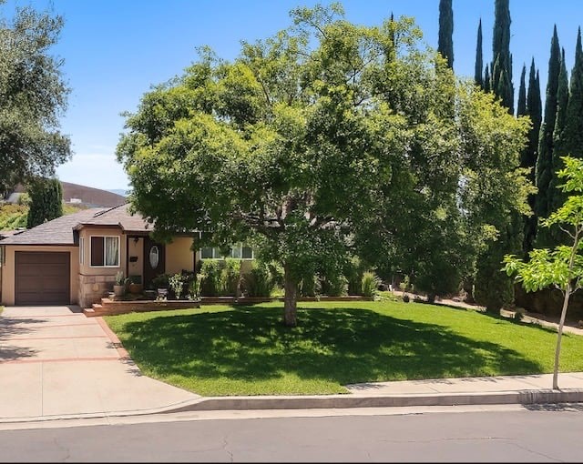 This versatile property features a 3 bed, 1 bath along with an additional bathroom on the exterior. Permitted ADU offers: 2 bed & 1 ba, providing flexible living arrangements. The main home offers softwood flooring in the living and dining areas, bedrooms, and hallway. Interior updates include granite countertops in the kitchen, modern low-voltage recessed lighting, and mostly newer vinyl windows. The property is equipped with central air conditioning and HVAC, a 200-amp electrical panel, and a whole-house water softener system. Solar panels are installed (owned) & will be paid through the close of escrow. Outdoor areas include a covered patio, multiple shaded sitting areas, and a designated play space. The detached ADU includes its own kitchen, bathroom, and living area. Conveniently located near the 5 Freeway, schools, parks, and shopping centers.