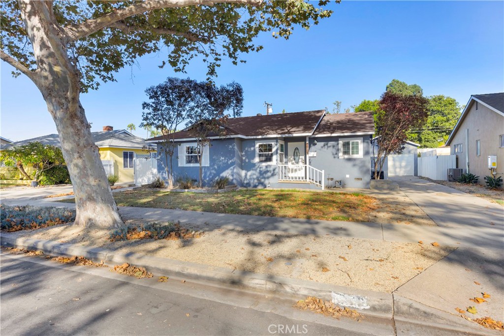 Nestled on a charming street in the heart of Orange, this inviting single-level home blends warmth, character, and thoughtful updates. Offering 1,148 square feet of living space, the floor plan includes 3 bedrooms and 1.5 bathrooms, set on a generous 6,180 square foot lot. Inside, enjoy a beautiful kitchen including granite countertops and stainless steel appliance, a spacious family room with brick fireplace, the primary bathroom offers a vanity with granite countertops and tub/shower combo, recent improvements enhance the home’s timeless appeal: beautifully refinished single plank hardwood floors, fresh interior paint throughout, updated faucets, a new dining room light fixture, and new blinds in the bedrooms. Additional upgrades include a new shower fixture and an automatic garage door for modern convenience for detached two car garage. Large windows fill the home with natural light, creating a bright and welcoming atmosphere. Outside, the expansive lot provides endless possibilities for entertaining or simply enjoying the California sunshine. With its blend of classic charm and modern updates, this is a wonderful opportunity to reside in the vibrant community of Orange.