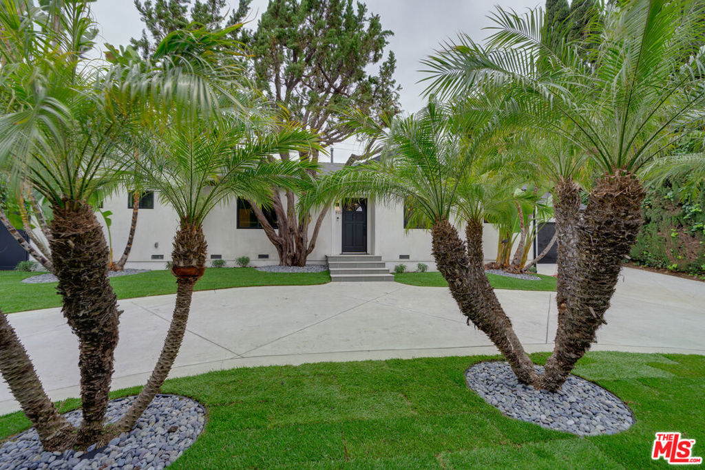 Welcome to this newly updated private retreat tucked behind lush privacy hedges in the heart of Studio City. No expense was spared on this fully and exquisitely remodeled 3 bed, 2 1/2 bath, 1,600 sq ft home. The well thought out open floor plan flows seamlessly from the living room to kitchen and dining area. The living room is a warm inviting space with large sliding glass doors opening to the spacious backyard with a covered porch. The newly updated Chef's kitchen has custom cabinets, quartz counters, stainless steel appliances, and a breakfast bar. The primary bedroom has a large walk-in closet and sliding doors also leading to the expansive back yard. The en-suite spa like bathroom has a large soaking tub. The two additional bedrooms are light filled and spacious with ample closets. The beautiful backyard offers a covered patio for Al Fresco dining and professionally designed and landscaped grounds for low water use and native plants. Almost everything in this home is brand new! The list of updates include brand new copper plumbing, tankless water heater, whole house filtration system, electrical, sewer, HVAC, Windows/glass doors, Roof, drainage system, retaining wall, driveway, landscaping, ring, cameras and all of the interior finishes throughout the home. The home's convenient location is walking distance to many restaurants, the Sportsmen's Lodge shops and markets, with easy access to freeways, parks and excellent schools.