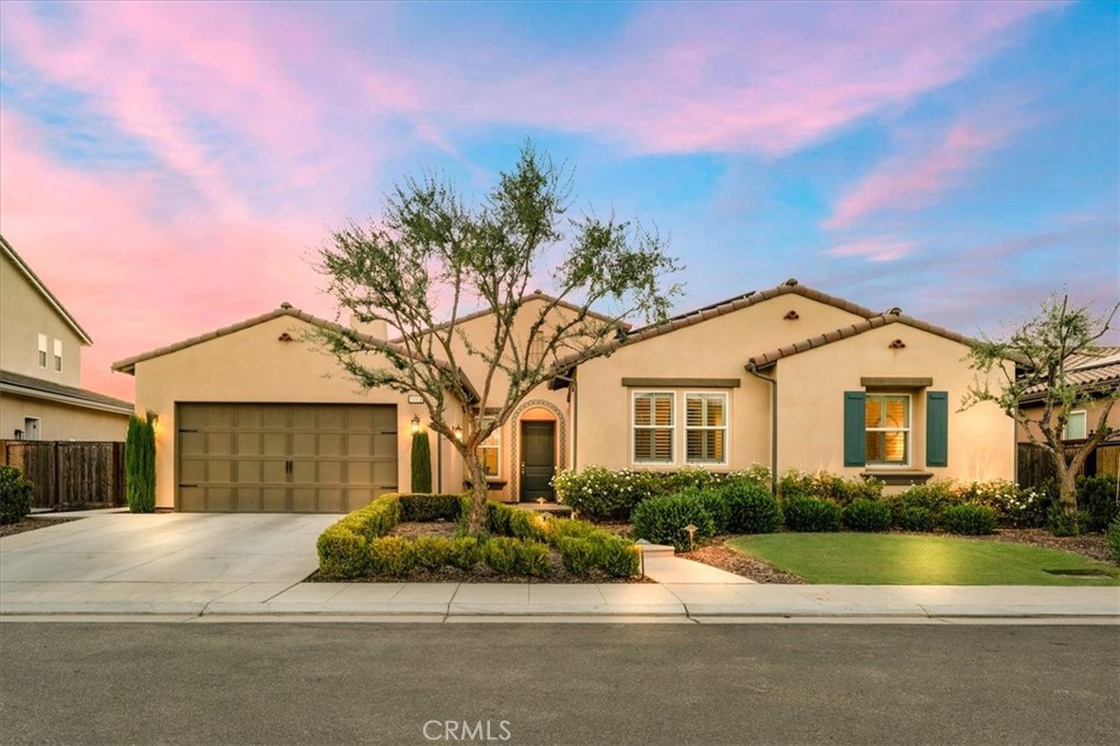 Experience refined living in Riverstone's prestigious Lafayette community. This 2020 Wathen-built single-story spans 2,954 sq. ft. on a 10,018 sq. ft. lot, offering 4 bedrooms, 3.5 baths, including a spacious owner's suite and private guest suite. The open-concept living area features a chef-inspired kitchen with a professional appliances, oversized island, and ample cabinet space. Enjoy multiple living spaces, including a guest living room, perfect for entertaining. Step outside to a sparkling pool, spa, and pergola ideal for California summers. Owned solar enhances efficiency, while a 3-car tandem garage adds convenience. Impeccable style, thoughtful design, and luxury upgrades throughout this home is a rare find in one of Madera's most desirable communities.