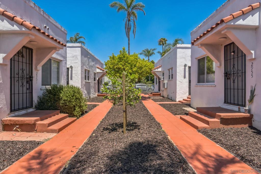 Presenting 2949–2957 Kalmia Street, a rare 8-unit Spanish-style bungalow court located between North Park and South Park, two of San Diego’s most desirable rental submarkets. This income-generating property features Five fully upgraded 2 bed/1 bath units, one 3 bed/2 bath unit and two newly constructed ADUs completed in 2025 — spacious 2 bed/2 bath, both featuring private yards. The bungalow court layout and lush landscaping provide excellent curb appeal and community charm. Situated on a large 10,679 sq ft lot with 4,136 sq ft of improvements, strong walkability to Target, Balboa Park, local cafes, and restaurants. Ideal for any investor seeking a stabilized, low-maintenance multifamily property in a premier San Diego location. This exceptional 8-unit property is a fully stabilized Spanish-style bungalow court located in the heart of North Park/South Park, two of San Diego’s most sought-after rental neighborhoods. The unit mix includes six upgraded 2 bed / 1 bath units, one 2 bed / 2 bath ADU, and one 3 bed / 2 bath ADU. Both ADUs were newly constructed in 2023 with final permits and feature modern finishes, in-unit laundry, and private yards. These newer additions complement the charm of the original bungalow-style layout, enhancing the appeal for tenants and boosting long-term rental value. The property sits on a large 10,679 sq ft lot with 4,136 sq ft of rentable living area, offering an excellent footprint for operations. The current scheduled gross annual income is $197,712.80, representing a 5.07% actual cap rate at list price. Tenants enjoy gated off-street parking and beautifully landscaped common areas. The location is highly walkable to Balboa Park, the San Diego Zoo, boutique coffee shops, breweries, and restaurants — making it one of the strongest rent-growth corridors in central San Diego. Renovations to five of the original six units include updated kitchens, bathrooms, paint, flooring, and finishes. One unit has been professionally staged to showcase its rental potential. This property is ideal for a 1031 exchange investor, long-term buy-and-hold owner, or anyone seeking a turnkey cash-flowing asset in a high-demand urban core. Additional documents available upon request include full rent roll, ADU permit history, and pro forma projections.
