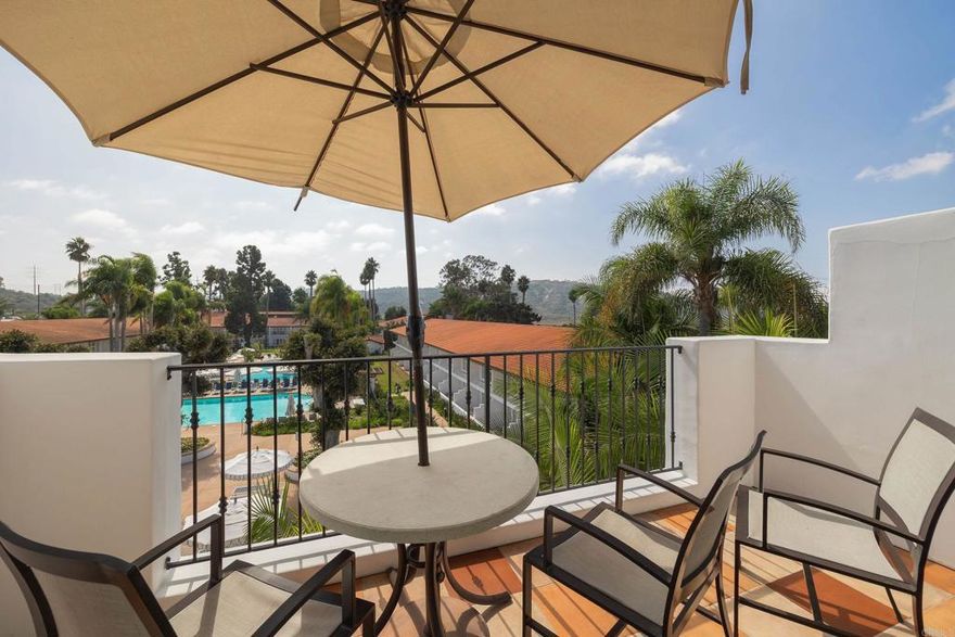 Discover resort living at its finest in this recently renovated, fully furnished top-floor luxury condo located at 7323 Estrella De Mar Road, Unit 47 in Carlsbad, CA. Spanning 1,234 square feet, this home features two spacious bedrooms, each with its own spa like en suite bathroom, providing comfort and privacy. Each can be rented or used separately or as a full two bedroom.   Step into a world of elegance with stunning pool, resort, and sunset views. The unit boasts two private balconies, perfect for relaxing and enjoying the picturesque views and ocean breezes. Cozy up by one of the two fireplaces, and enjoy the convenience of air conditioning and an in-unit washer and dryer.  This property has a strong rental history, making it an excellent option as a second home and income property. As an added bonus, it includes a popular Sport membership to the Club at La Costa. Owners will have access to a pool, spa, and ample parking. Experience the ultimate in resort-style living in a premier location that combines tranquility with the best of the southern California lifestyle. This is a full ownership property and owners may reside in it up to 120 days per year with the option of renting it and generating income while away.   Reach out today to make this exceptional property your own oasis!