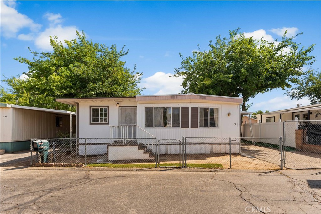 Welcome to this spacious and upgraded 4-bedroom, 2-bath manufactured home offering unbeatable value just minutes from the 14 Freeway and Pearblossom. Set in a quiet, amenity-rich community with an incredibly low land lease of only $650/month—which includes all utilities like electricity, water, and gas—this home provides long-term affordability and equity growth potential. The interior features an abundance of natural sunlight, a spacious dining area, and a well-equipped kitchen with plenty of cabinetry for all your cooking needs. A recent expansion adds even more usable space, along with an extra bonus room perfect for a home office, playroom, or creative studio. All bedrooms are generously sized, and there's a dedicated laundry area for added convenience. Step outside to your gated lot featuring a 2-car carport, a spacious private backyard, and peace of mind with added security. The community offers fantastic amenities, including a clubhouse for events, a swimming pool, a gym, a playground, and large greenbelt areas perfect for relaxation and recreation. Plus, with plenty of guest parking, hosting family and friends is always easy and stress-free. Conveniently located near top grocery stores, restaurants, shopping, and entertainment, this home is ideal for families or anyone seeking comfort, convenience, and community—at a fraction of the cost of traditional homeownership. Don’t miss your chance to own this gem!