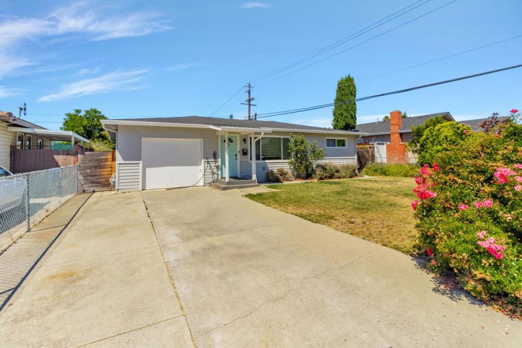 With a spacious, landscaped backyard, inviting open layout, and a location near parks and schools, this 3-bedroom, 1.5-bath San Jose home offers both everyday comfort and practical perks. The main living area flows easily between the cozy living room and a well-designed kitchen, where generous cabinetry, stainless steel appliances, and a sleek subway tile backsplash complement the space. A dedicated dining area anchors the layout, with pendant lighting above and wide-plank flooring below that brings warmth throughout. Youll find all three bedrooms tucked into a sensible floor plan, along with a full bathroom and a convenient half bath to support daily routines. Additional highlights include a security system with cameras and automatic sprinklers. The backyard is a standout feature, with its large patio, grassy lawn, vibrant flowering bushes, and a covered seating area complete with ceiling fan and fire pit. Plus, there's extra storage available in the side yard. Living here means you're just minutes from Overfelt Gardens Park and a short stroll to San Antonio Elementary. Everyday essentials are within easy reach too, with shopping, groceries, and freeway access all conveniently nearby. *Fireplace is for decorative use only and cannot be used without consent from Belong.