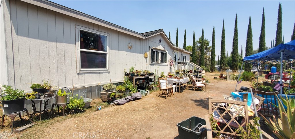 Nice family home next to Elder Creek with recent work done; in 2025 the home was re-leveled and new skirting added, a new 3'x3' back porch, and a new hot water heater. In 2024 a new pump was installed along with a 2500 gallon tank. In 2023 a water filtration system was installed, and also a new roof that year. This home is located near the Rancho Tehama Elementary School, the air strip, a church, the volunteer fire department, a park and the waste station. DO NOT disturb tenants, appointment only with a 24 hour notice required.
