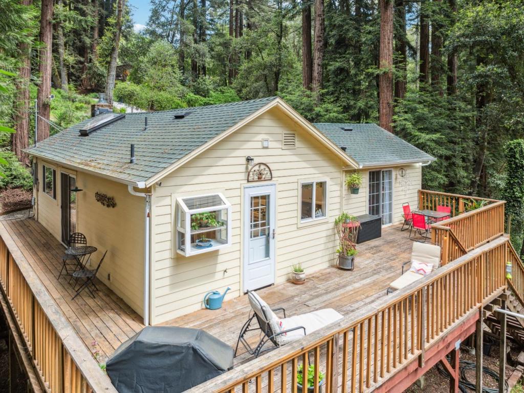Nestled among the towering redwoods of Felton, 415 Gold Ave offers a serene escape with modern comforts. This 1-bedroom, 2-bathroom home spans 848 sq ft on a generous 9,408 sq ft lot, providing ample space for relaxation and outdoor enjoyment. Built in 1941, this single-family residence exudes rustic charm while offering contemporary amenities. The open-concept living area features vaulted ceilings and abundant natural light, creating an inviting atmosphere. The kitchen is equipped with updated appliances and stylish finishes, perfect for culinary enthusiasts. The spacious bedroom serves as a tranquil retreat, complemented by two well-appointed bathrooms. Outside, the expansive deck is ideal for entertaining or simply soaking in the natural beauty of the surrounding forest. Located just minutes from downtown Felton, residents can enjoy local shops, dining, and easy access to hiking trails and parks.