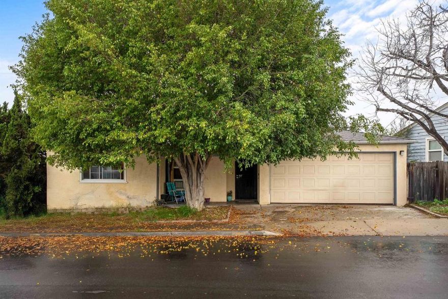 Exceptional potential in the sought-after neighborhood Rolando Park. The main level offers a thoughtfully designed layout featuring two bedrooms, a full bathroom, expansive family room, living room, kitchen, dining area, and convenient access to a two-car garage. The lower level enhances the home’s versatility with two additional bedrooms, a full bathroom, and a generous family room, accessible from the main level or via a private entrance—ideal for guests or multi-generational living. Outdoor living is highlighted by a large deck overlooking a lush, private backyard complete with a hot tub.