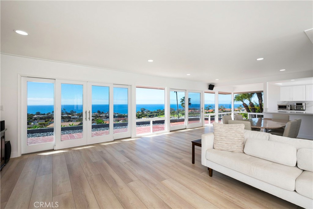 AVAILABLE UNFURNISHED. Perched in the coveted community of Monarch Bay Terrace, this beautifully updated Dana Point home showcases expansive ocean views that extend to Catalina Island. The panoramic vistas can be enjoyed from the kitchen, dining room, living area, and several other rooms throughout the home.
Designed for both comfort and style, the open floor plan includes 5 bedrooms, a dedicated office/den, and 3.5 bathrooms. Recent upgrades include new flooring throughout, a reimagined kitchen with modern finishes, refreshed bathrooms, and more.
Double wooden entry doors lead to a spacious private patio, seamlessly blending indoor and outdoor living. The open-concept kitchen connects effortlessly to the dining and living spaces, where a cozy fireplace and direct patio access create the perfect setting for entertaining.
Ideally situated just minutes from world-class resorts, the private Monarch Bay Beach Club, championship golf courses, and the yacht clubs of Dana Point Harbor, this home offers both luxury and lifestyle. Whether soaking in the views or exploring the nearby coastal towns of Laguna Beach, San Juan Capistrano, San Clemente, and Laguna Niguel, you’re perfectly positioned to enjoy all that Southern California has to offer—conveniently located about an hour from both Los Angeles and San Diego. Available starting June 16th.